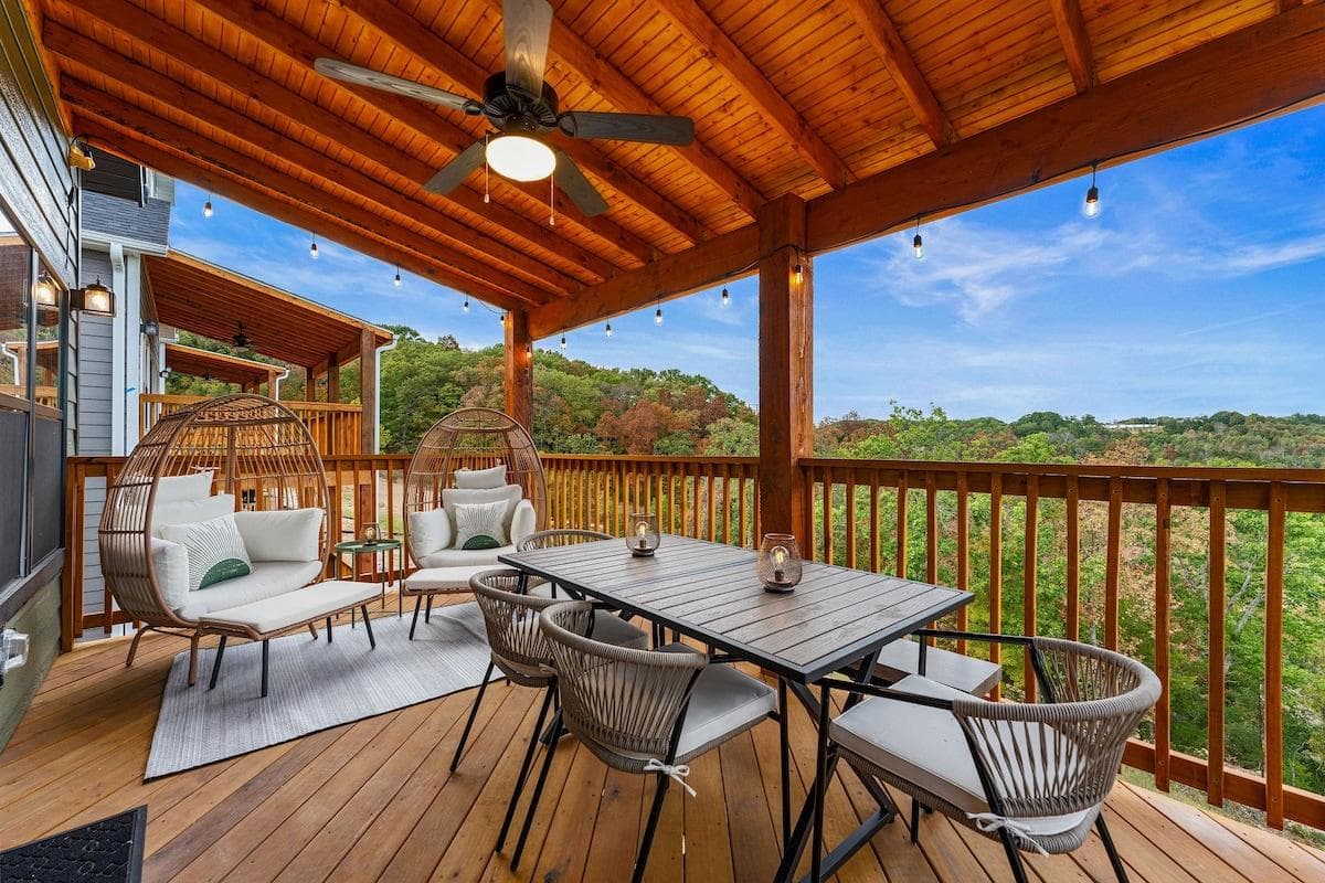 Private main level deck: Unwind amidst stunning views in stylish chairs and vibrant decor!